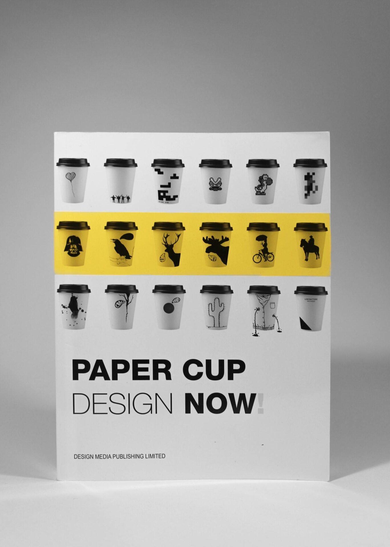 Showcase of various artistic paper cup designs on a magazine cover with a creative layout.